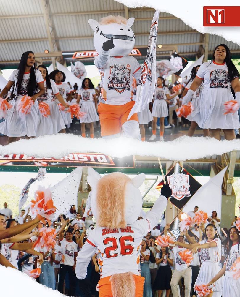 Mascote e torcida com camisas Elite de Cristo em evento esportivo